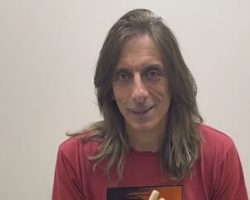 Why Does JUDAS PRIEST's SCOTT TRAVIS Hold His Drumsticks Upside Down? He Explains